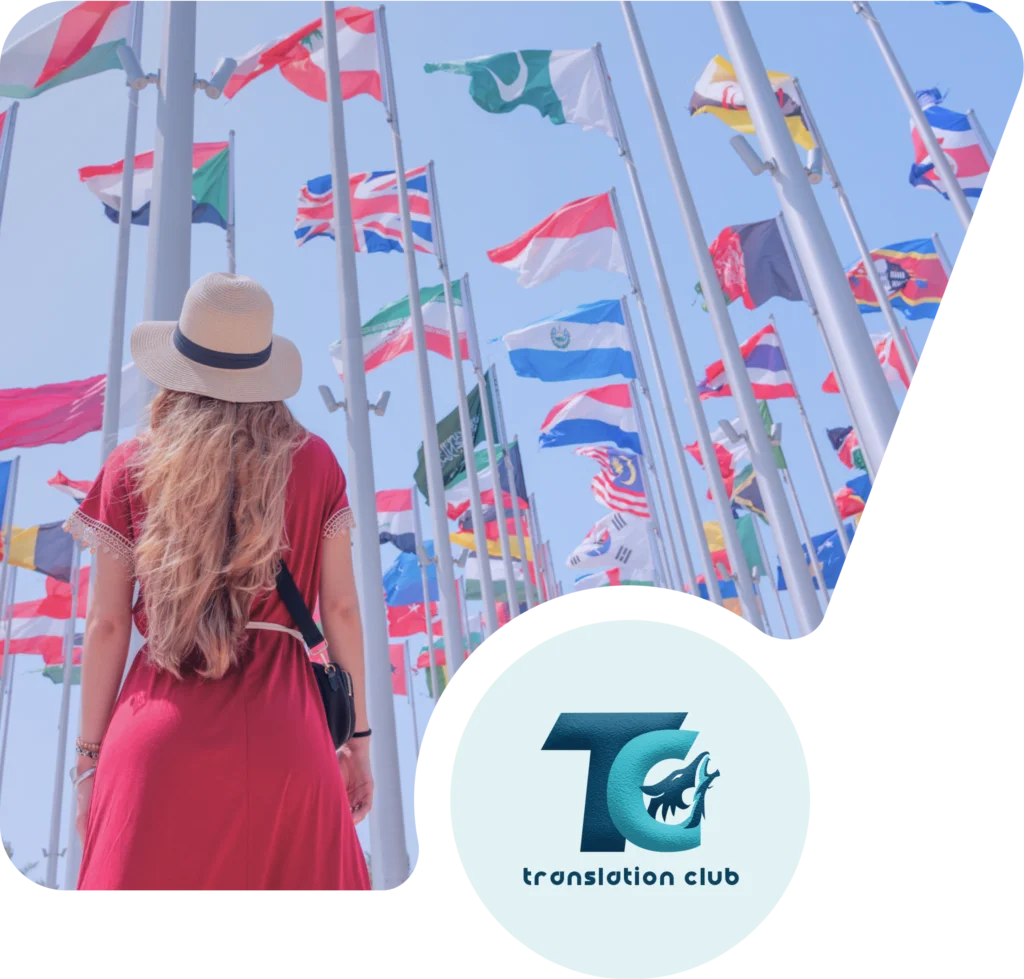Visitor standing among flags from different countries