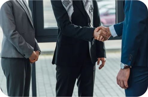 Business partners shaking hands during a meeting