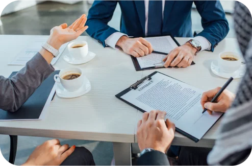 Discussing documents and agreements at a business meeting