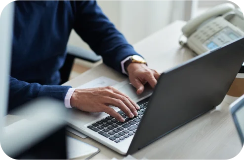 Working on a laptop in an office