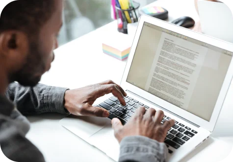 Typing and reviewing text on a laptop